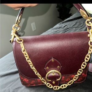 BURGUNDY COACH HANDBAG